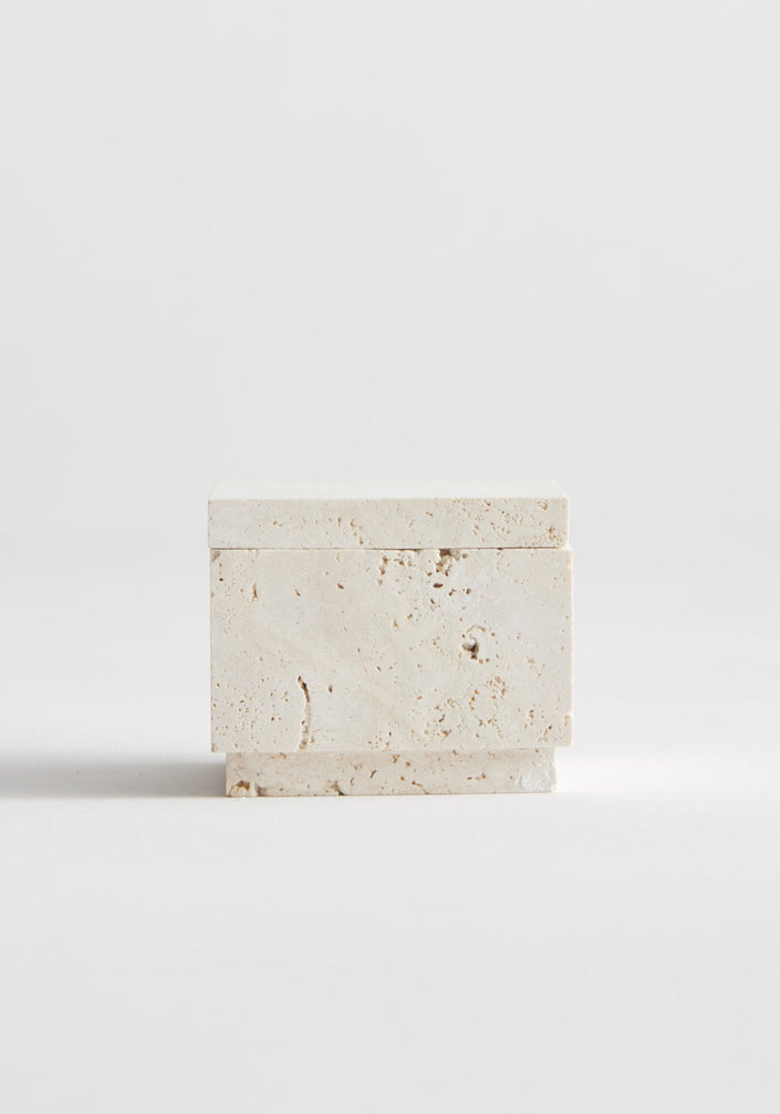 Tealight box | travertine: A handcrafted, light stone square holder with a round well for a candle, featuring a removable matching lid, made from leftover travertine.