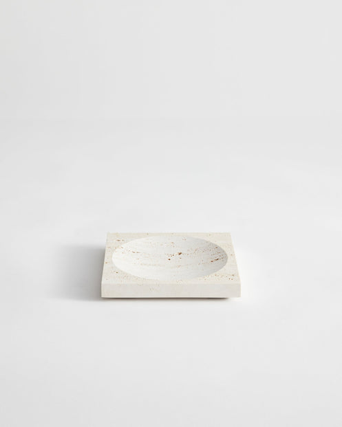 Small tray | travertine: Square stone tray with a round indent, handcrafted from leftover travertine by Dutch artist Louis Crombag, showcasing minimalist design.