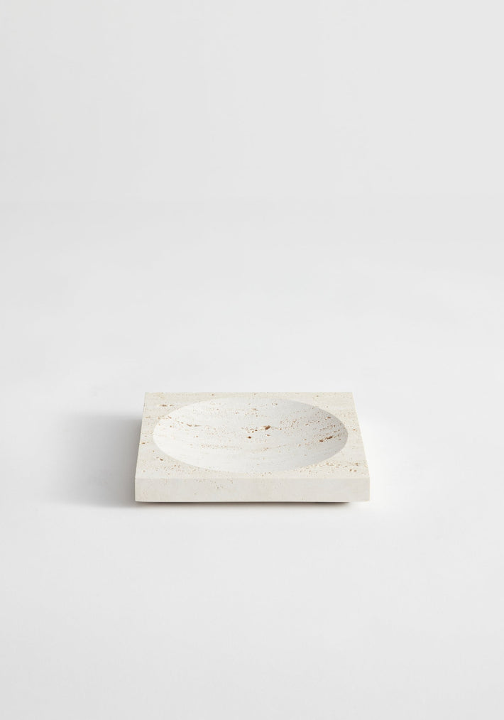 Small tray | travertine: Square stone tray with a round indent, handcrafted from leftover travertine by Dutch artist Louis Crombag, showcasing minimalist design.