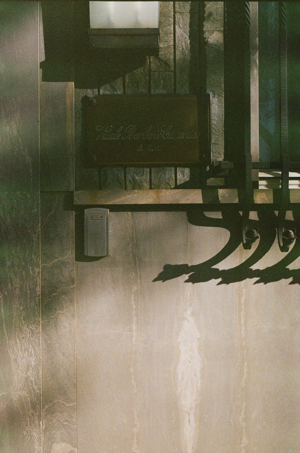 Decorative metal bracket on a textured wall
