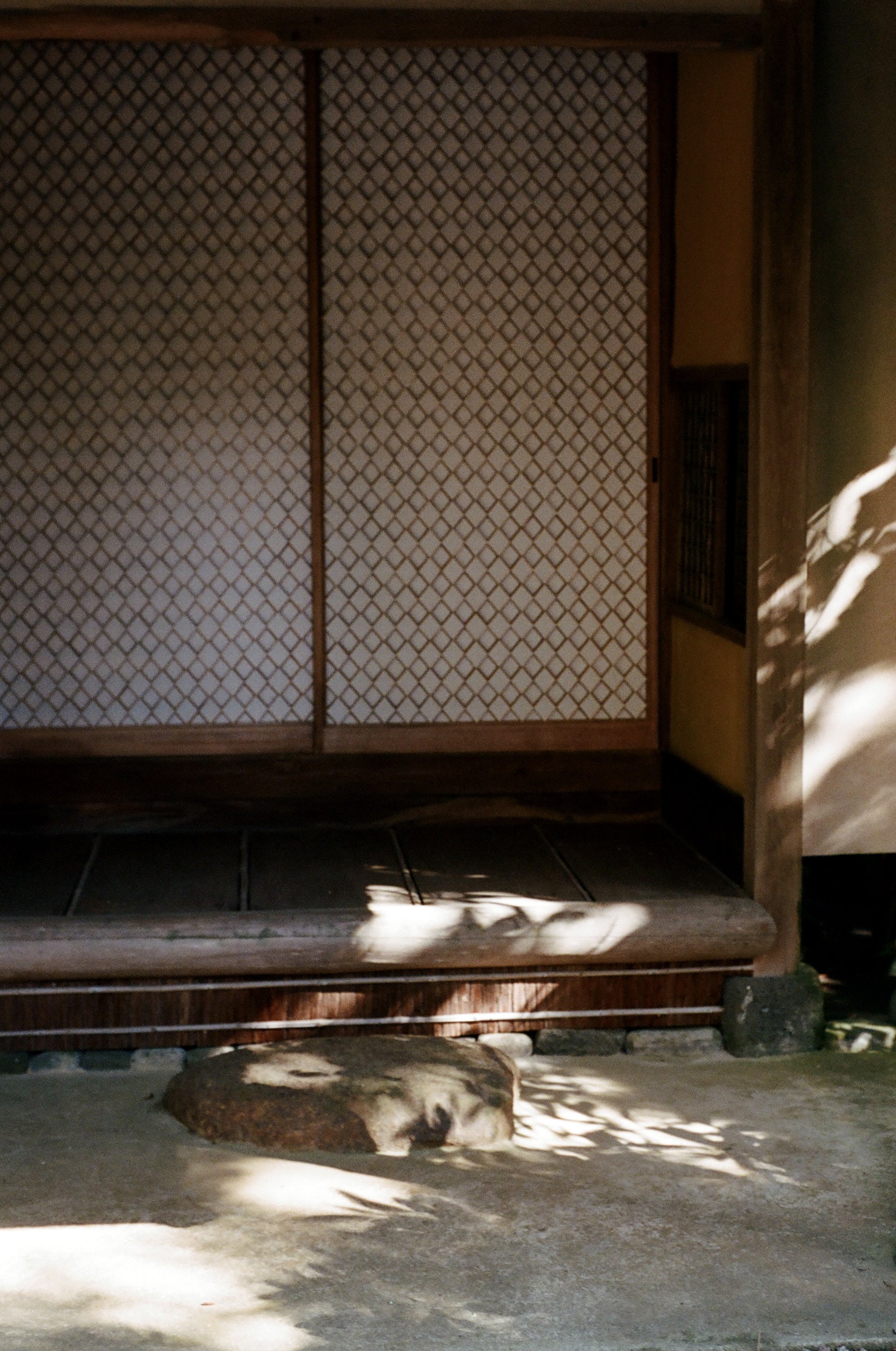 Shoji doors paneled with an intricate wooden design. 