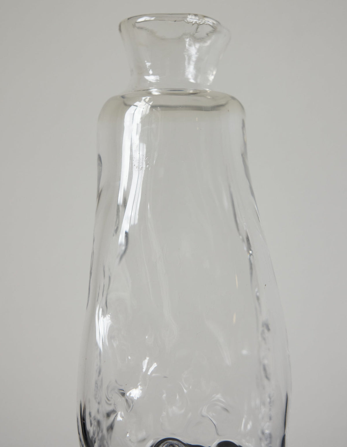 Close-up of the Blown vase | Glass by Szkło Studio, showcasing its unique wavy texture, exemplifying hand-blown craftsmanship and functional artistry.