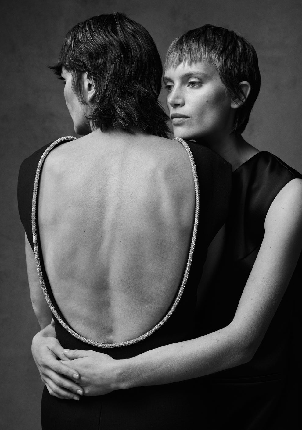 Black and white portrait of a daughter embracing her mother 