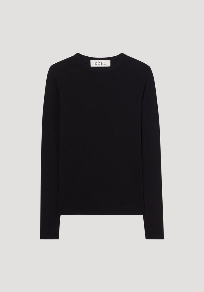 Fine merino long sleeve | black: A fitted black long-sleeve crew-neck shirt made from 100% merino wool, featuring a “RÓHE” label at the inside back collar.