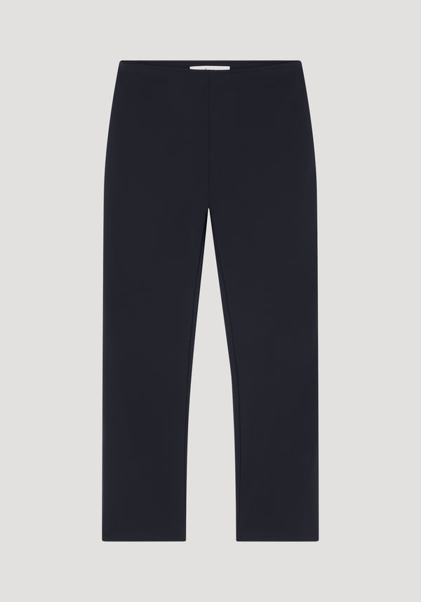 Cigarette scuba trousers in black, featuring a slim-fitting, tailored ankle-length silhouette crafted from premium heavyweight scuba fabric, laid front-facing on a neutral background.