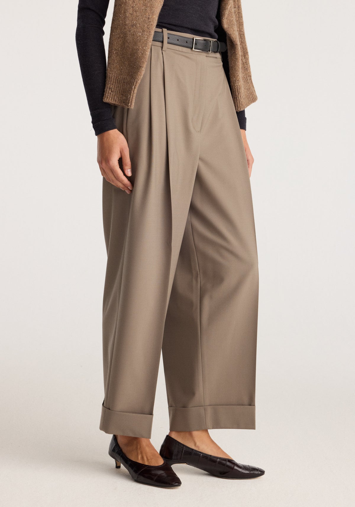 High-waist turn-up trousers | taupe worn with a black top, brown cardigan, belt, and black loafers, featuring wide legs and cuffed hems
