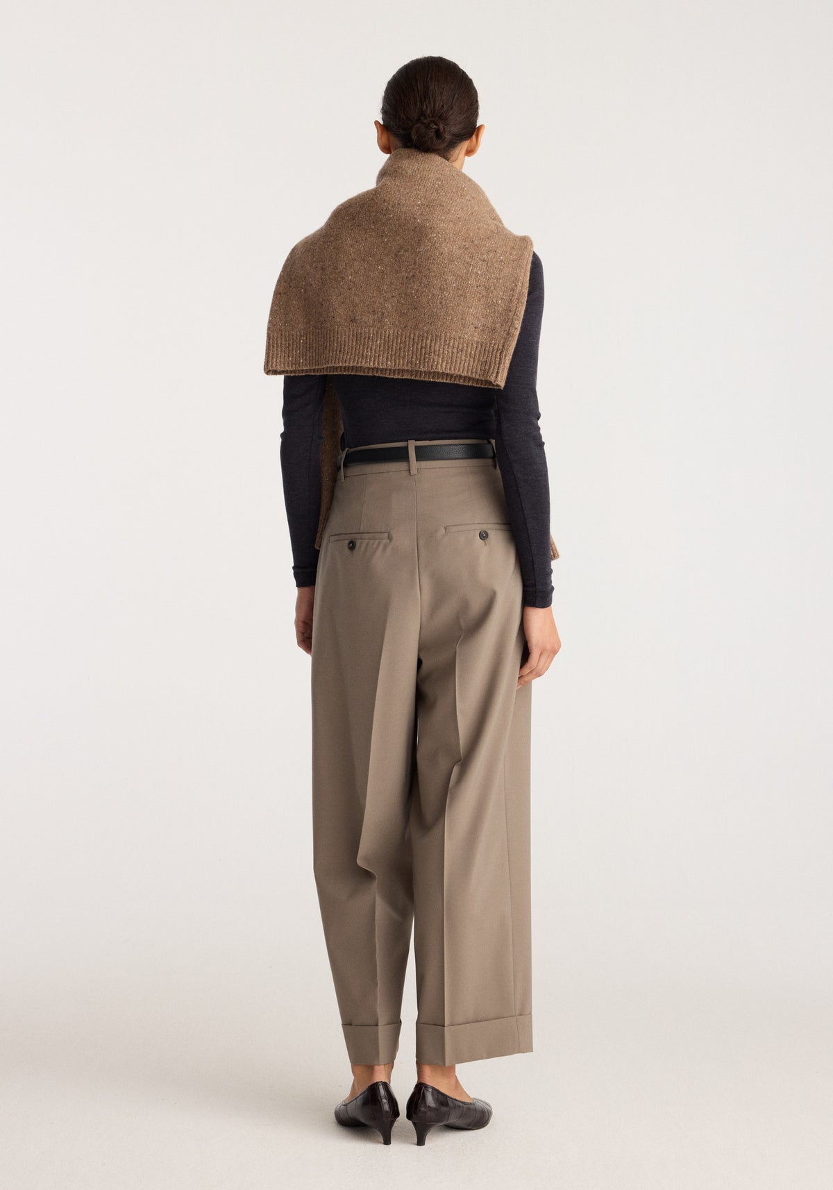 High-waist turn-up trousers | taupe shown from the back on a model with wide cropped legs turned-up hems and a black belt