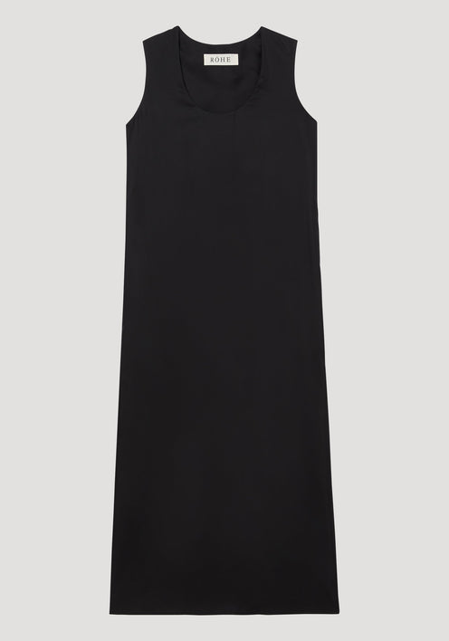 Scoop-neck silk dress | black: Sleeveless, floor-length black dress with a relaxed tank-style silhouette and deep scoop neckline, made from luxurious 100% silk, labeled “RÓHE.”