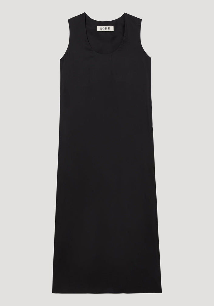 Scoop-neck silk dress | black: Sleeveless, floor-length black dress with a relaxed tank-style silhouette and deep scoop neckline, made from luxurious 100% silk, labeled “RÓHE.”