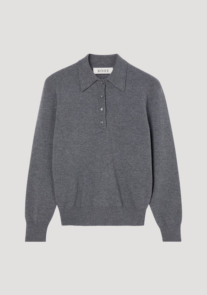Compact knitted polo in mid grey melange, featuring a long-sleeve design, pointed collar, four-button placket, and ribbed cuffs, crafted from Italian wool-cashmere blend.