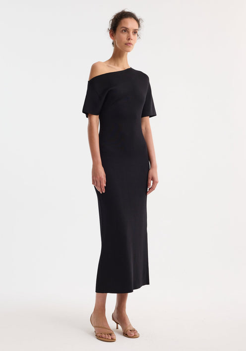 Asymmetrical knitted dress | black, showcasing elevated minimalism and quiet confidence with sculptural tailoring, intentional contrasts, and high-end craftsmanship for a timeless design and long-lasting investment.