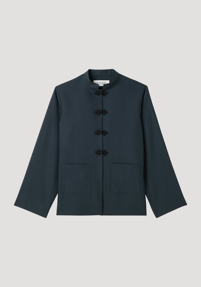 Mandarin jacket | storm: Dark-navy, hip-length with a stand-up collar, frog closures, patch pockets, and long sleeves. Made from soft, pure wool.