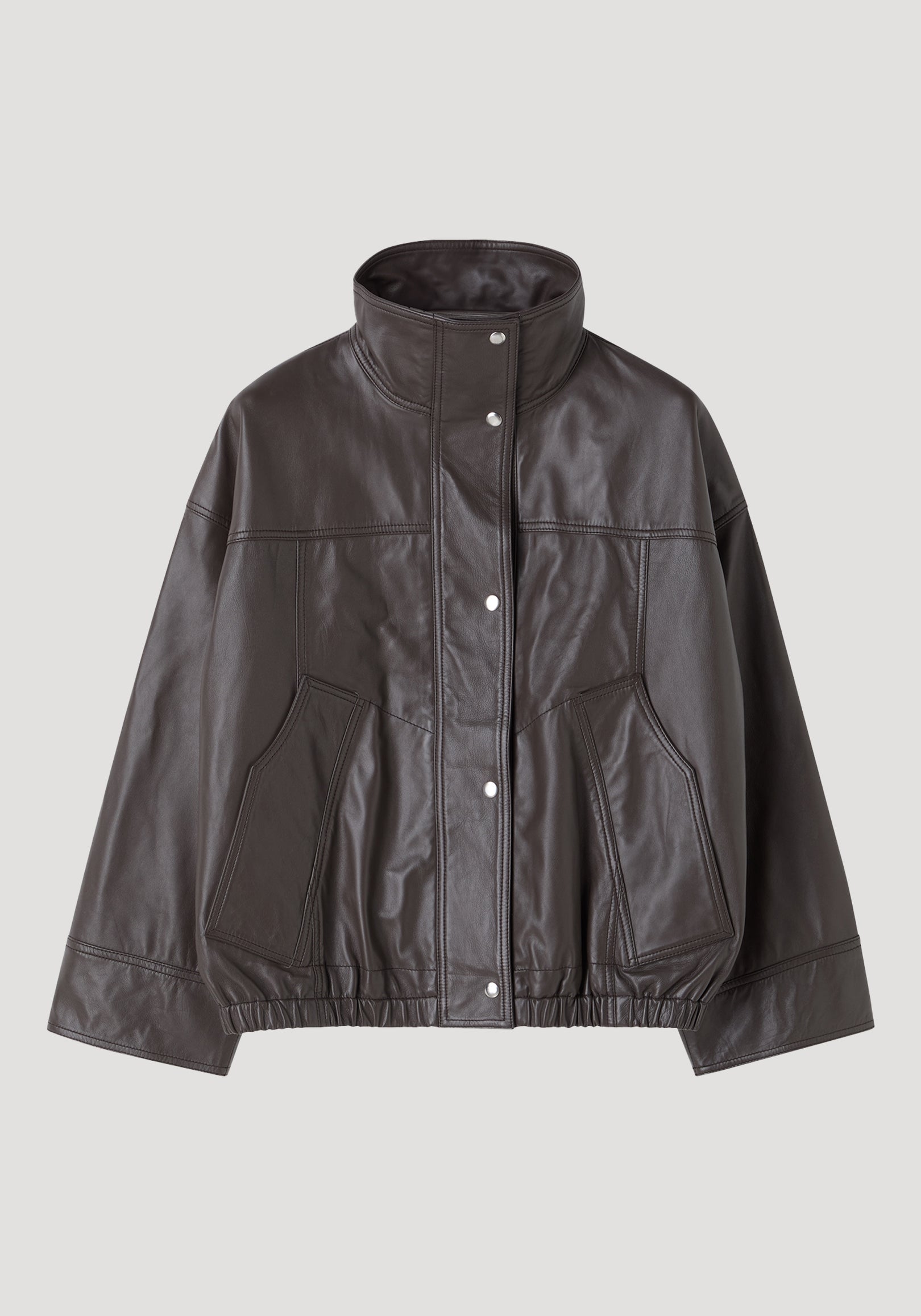 Dark brown leather jacket with high collar, snap button closure, and elasticized hem, styled in a modern design called Reinvented leather jacket | earth.