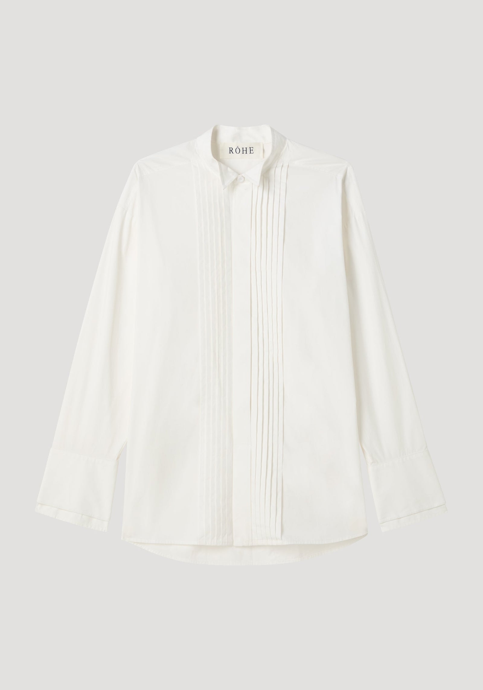 Tuxedo wired shaped shirt in optic white, featuring a hidden placket, vertical pintucks, stand collar, and statement cuffs, crafted from 100% cotton.