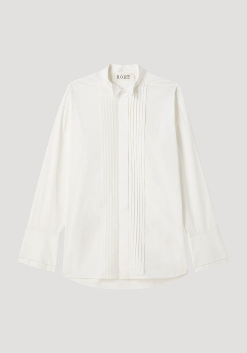 Tuxedo wired shaped shirt in optic white, featuring a hidden placket, vertical pintucks, stand collar, and statement cuffs, crafted from 100% cotton.
