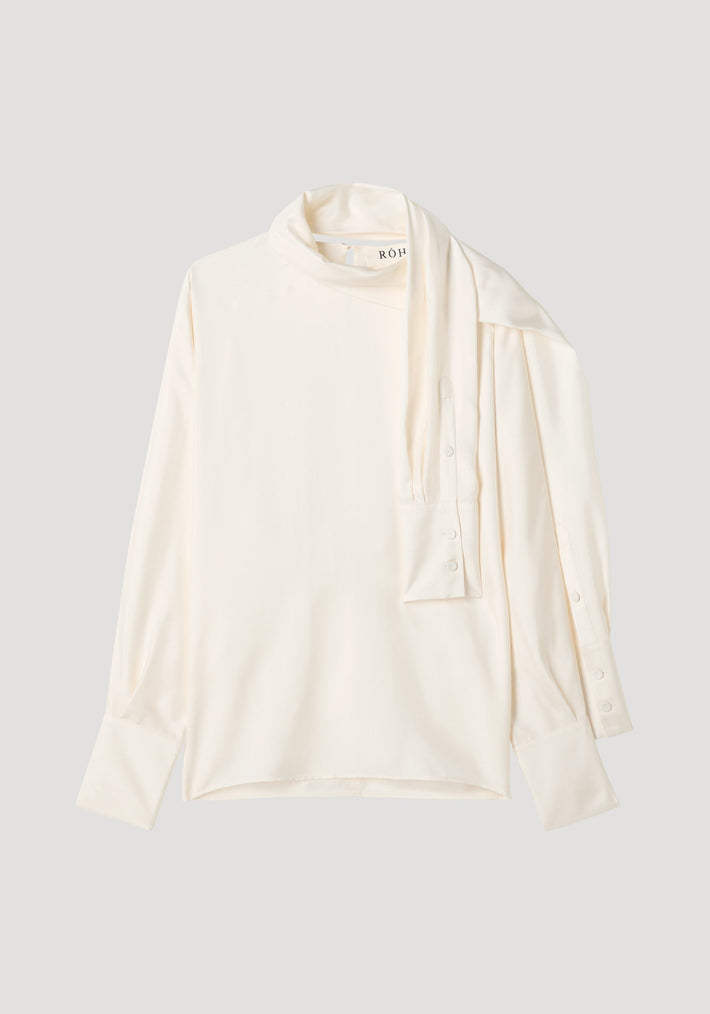 Foulard silk top | cream: Off-white blouse with draped scarf-like neck, button-cuff sleeves, and fluid silhouette. Made from pure silk, featuring RÓH label.