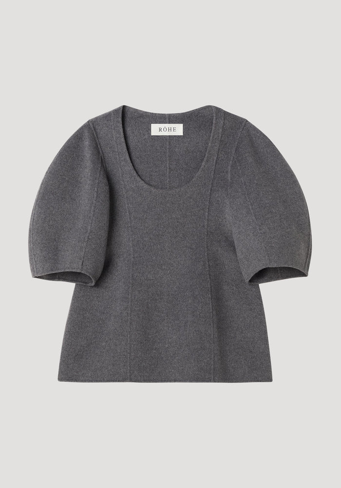 Sculptural double-faced top in mid grey melange, featuring a deep scoop neck, elbow-length balloon sleeves, and a structured peplum flare for a feminine silhouette.