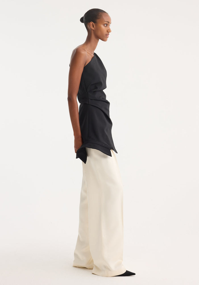 Reimagined one shoulder top | black, featuring an asymmetrical design with a deconstructed shirt collar, worn by a model with wide-leg trousers.