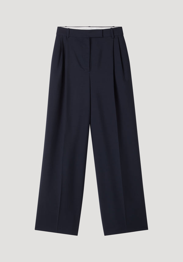 Mid-waist tailored trousers in navy, featuring a wide-leg design with double pleats and belt loops, crafted from a wool-mohair blend for structure and breathability.