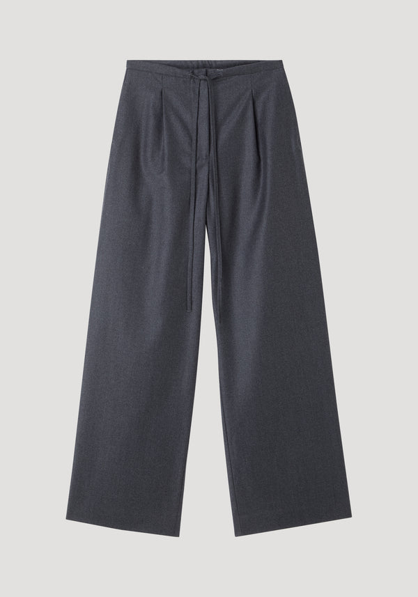 Relaxed soft wool trousers in dark grey melange, featuring a wide-leg silhouette and an elegant drawstring waistband, crafted from lightweight virgin wool for everyday comfort.