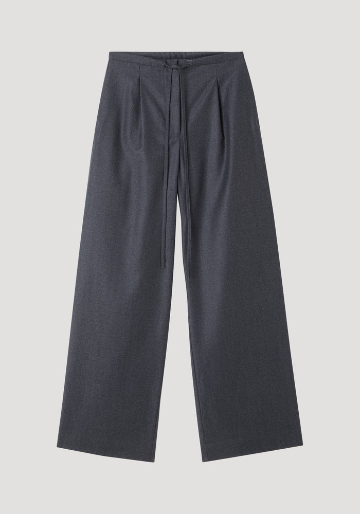 Relaxed soft wool trousers in dark grey melange, featuring a wide-leg silhouette and an elegant drawstring waistband, crafted from lightweight virgin wool for everyday comfort.