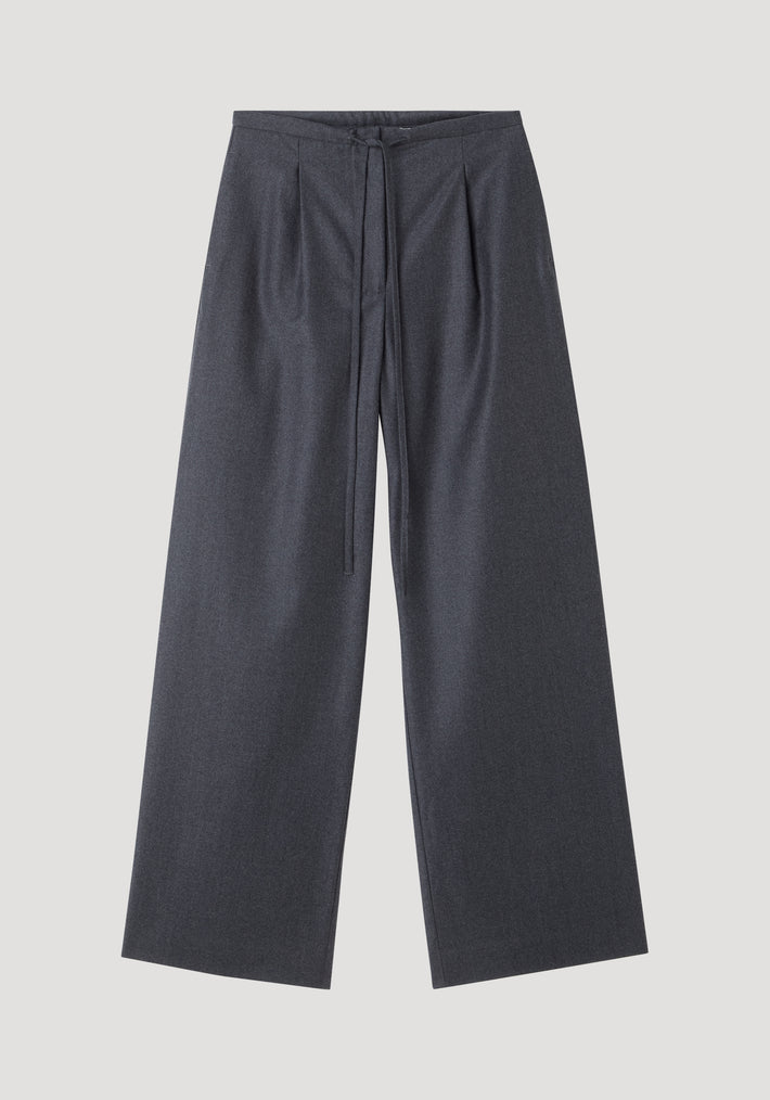 Relaxed soft wool trousers in dark grey melange, featuring a wide-leg silhouette and an elegant drawstring waistband, crafted from lightweight virgin wool for everyday comfort.