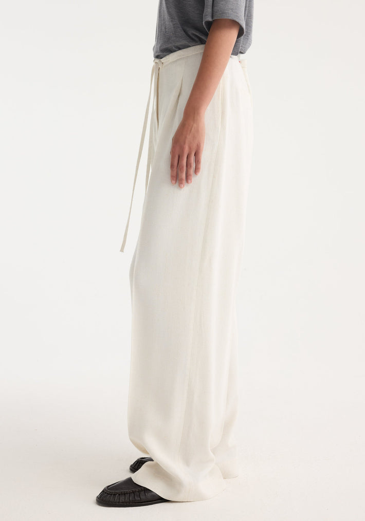 Relaxed drawstring trousers in winter white, featuring a wide-leg silhouette and a comfortable drawstring waistband, crafted from a light silk blend for effortless movement.