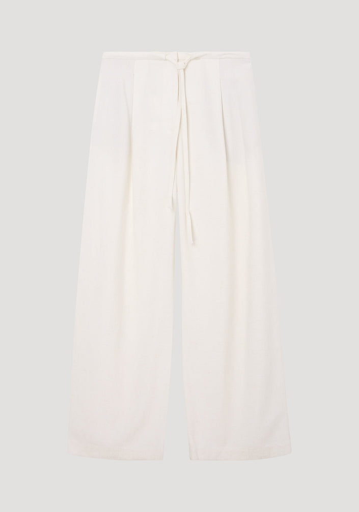 Relaxed drawstring trousers in winter white, featuring a wide-leg silhouette, lightweight silk-blend fabric, drawstring waistband, and subtle pleating for effortless movement.