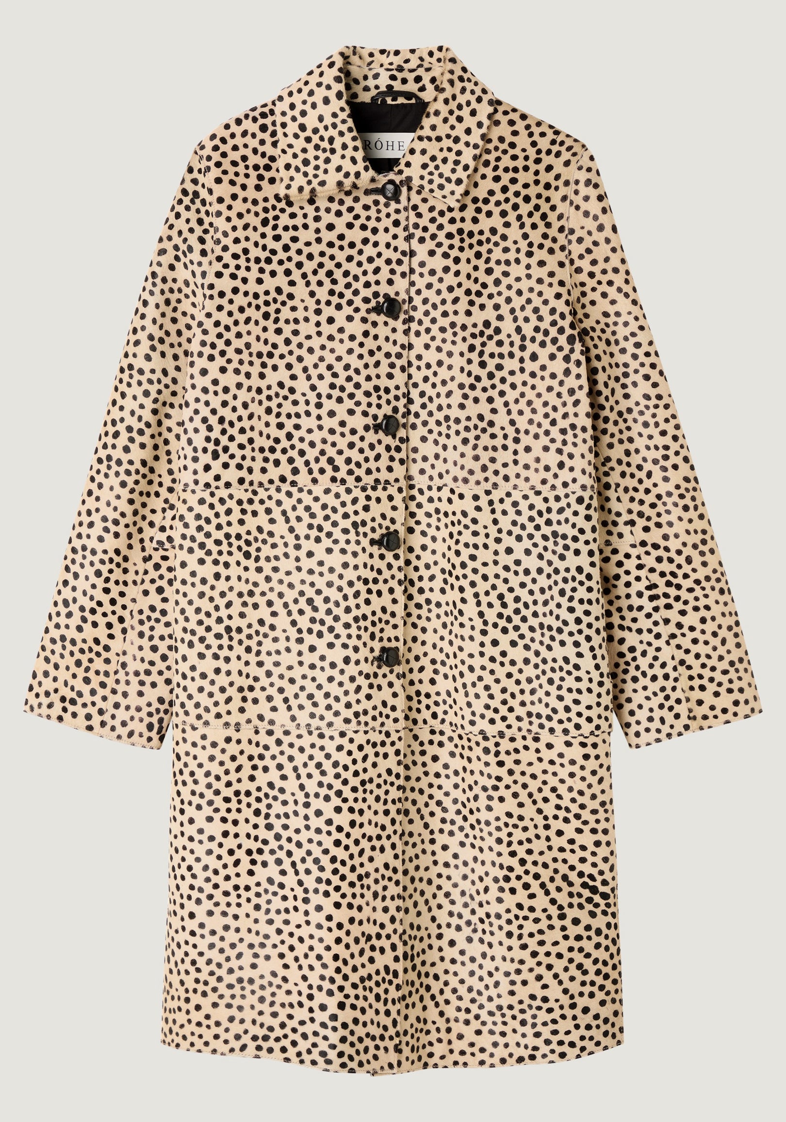 Pony hair coat | cheetah featuring long sleeves, a button-down front, and a beige base with an all-over black spotted pattern resembling cheetah print.