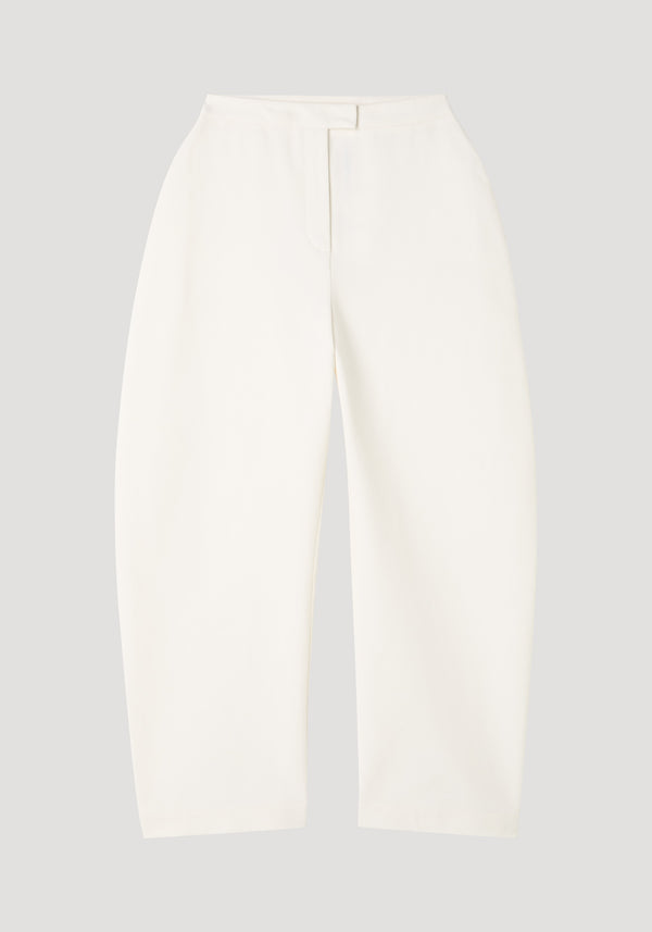 Sculptural trousers in paper white, featuring a high waist and bold balloon legs, crafted from structured cotton with a satin finish.