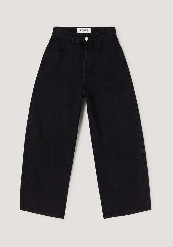 Barrel leg denim | black, featuring a high-waisted, wide-leg design with a curved, slightly cropped silhouette. Branded “RŌHE” label on waistband, crafted from 100% cotton.