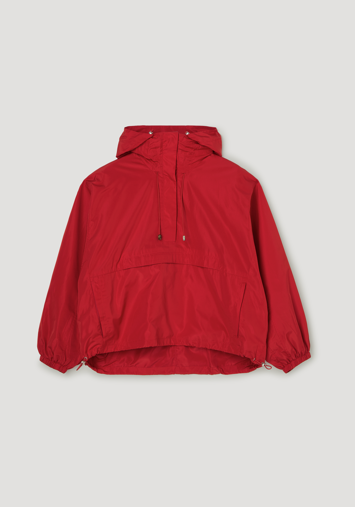 Volume silk-blend anorak in red, featuring a hood with adjustable drawcords, half-zip front, front pocket, zippered side pockets, and elasticized cuffs.