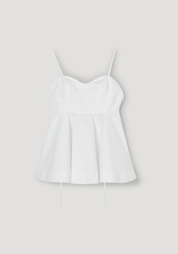 Bustier peplum top | optic white features a fitted bust, subtle sweetheart neckline, adjustable spaghetti straps, and a flared peplum hem, laid flat on a neutral background.