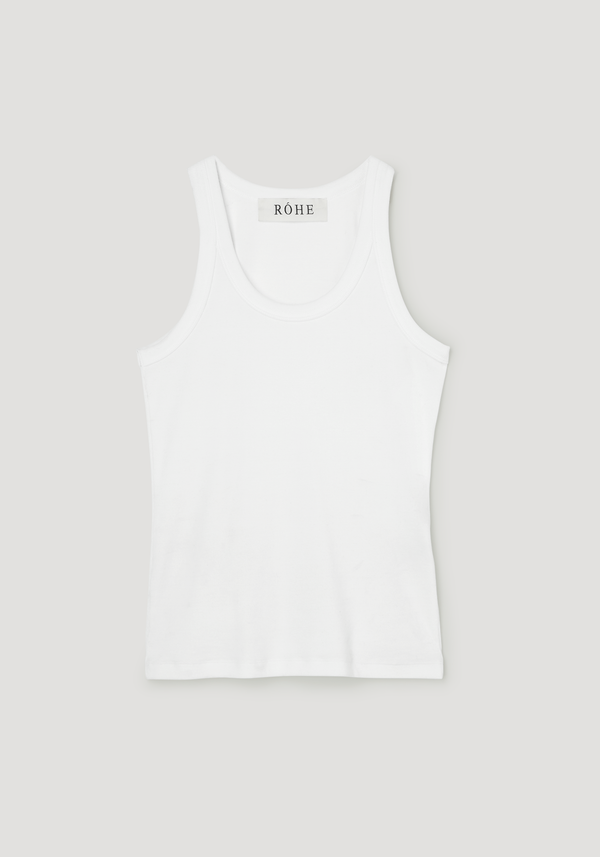 Scoop-neck rib top in optic white, featuring a racerback design with a ribbed texture, laid flat, highlighting its classic style and RÓHE label at the neckline.