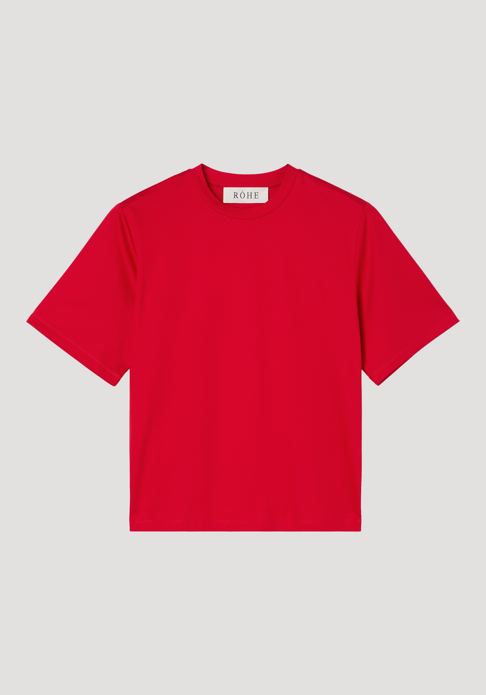 Oversized cotton silk t-shirt in red, featuring a crew neck, short sleeves, and drop shoulders, laid flat with a visible “RÓHE” label inside the collar.