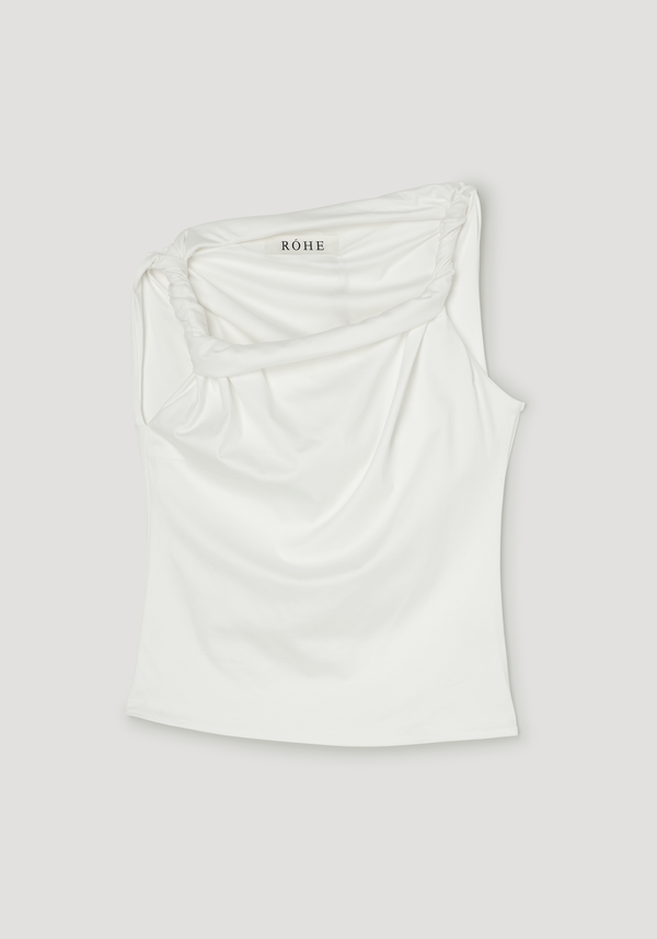 Sculptural cotton silk top in off white, featuring a draped one-shoulder design with twisted strap details, showcasing a relaxed, asymmetrical silhouette.