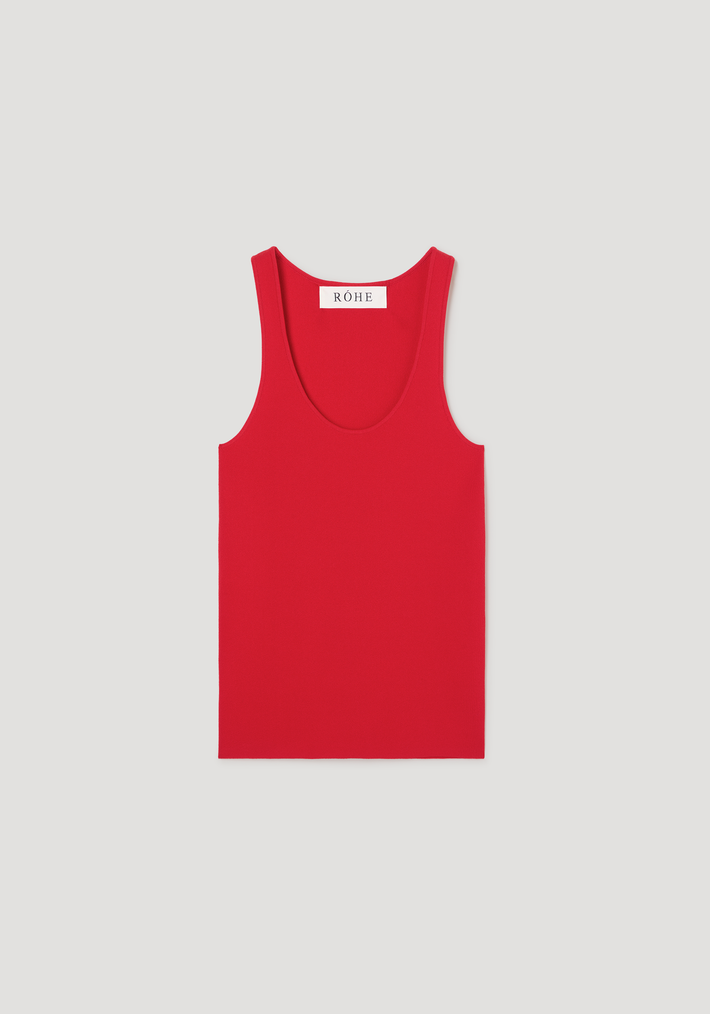Scoop neck knitted top in seasonal red, sleeveless with a bustier neckline, fitted shape, crafted from viscose blend. Features “RÓHE” label at the back neck.
