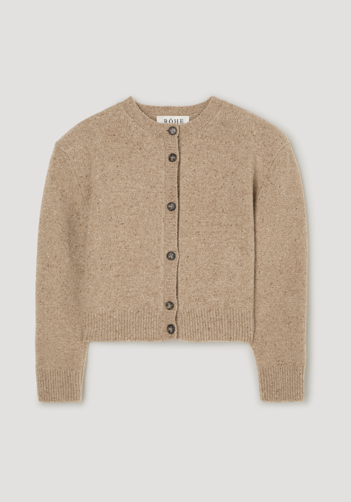 Fine merino tweed cardigan in oat melange, featuring a crew neckline, ribbed cuffs, dark buttons, slightly cropped fit, and shoulder pads, made of 100% merino wool.