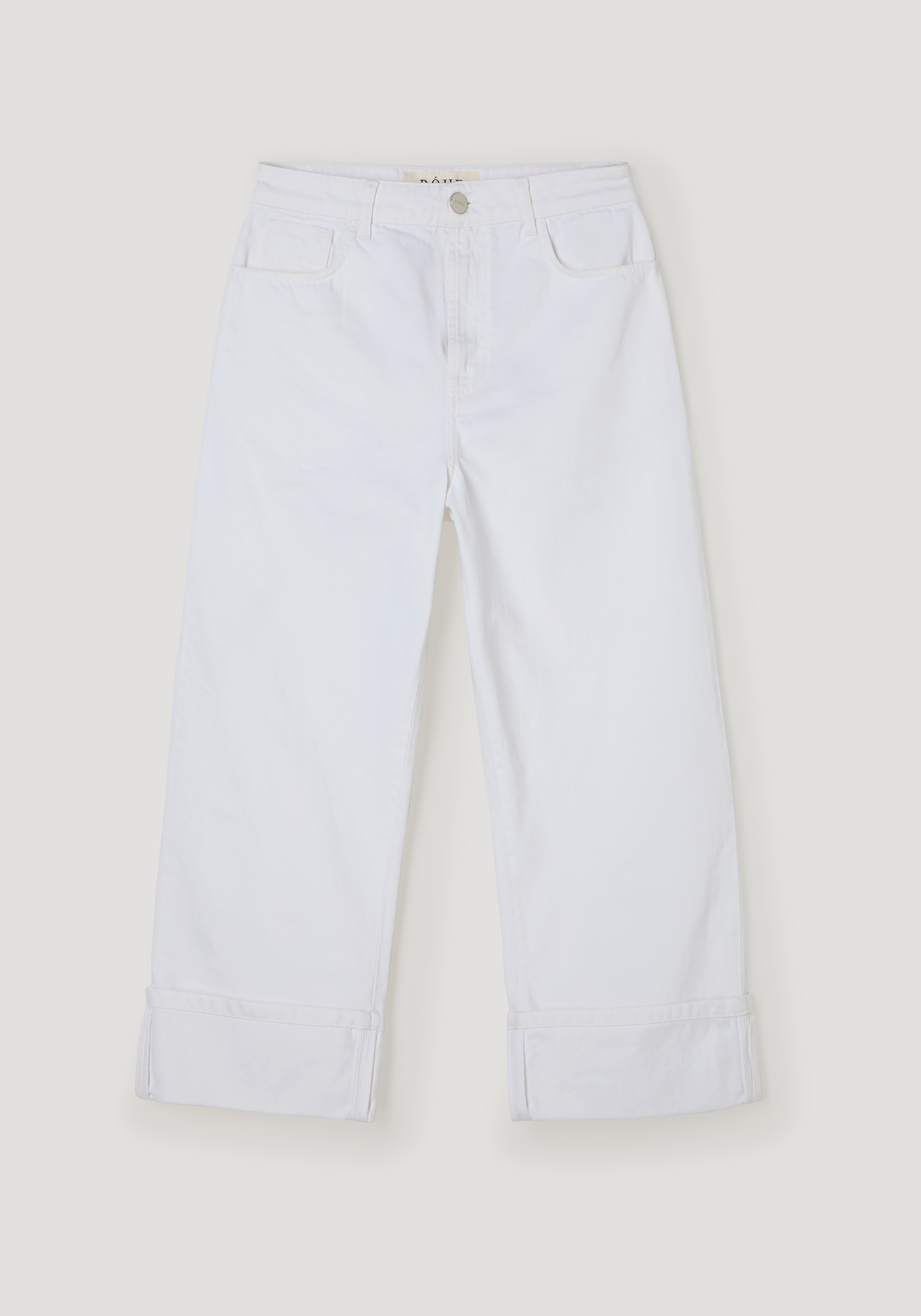 Baggy fit turn-up denim in optic white, featuring a low-waist, wide-leg design with rolled cuffs, silver button closure, and front pockets, made of 100% cotton.