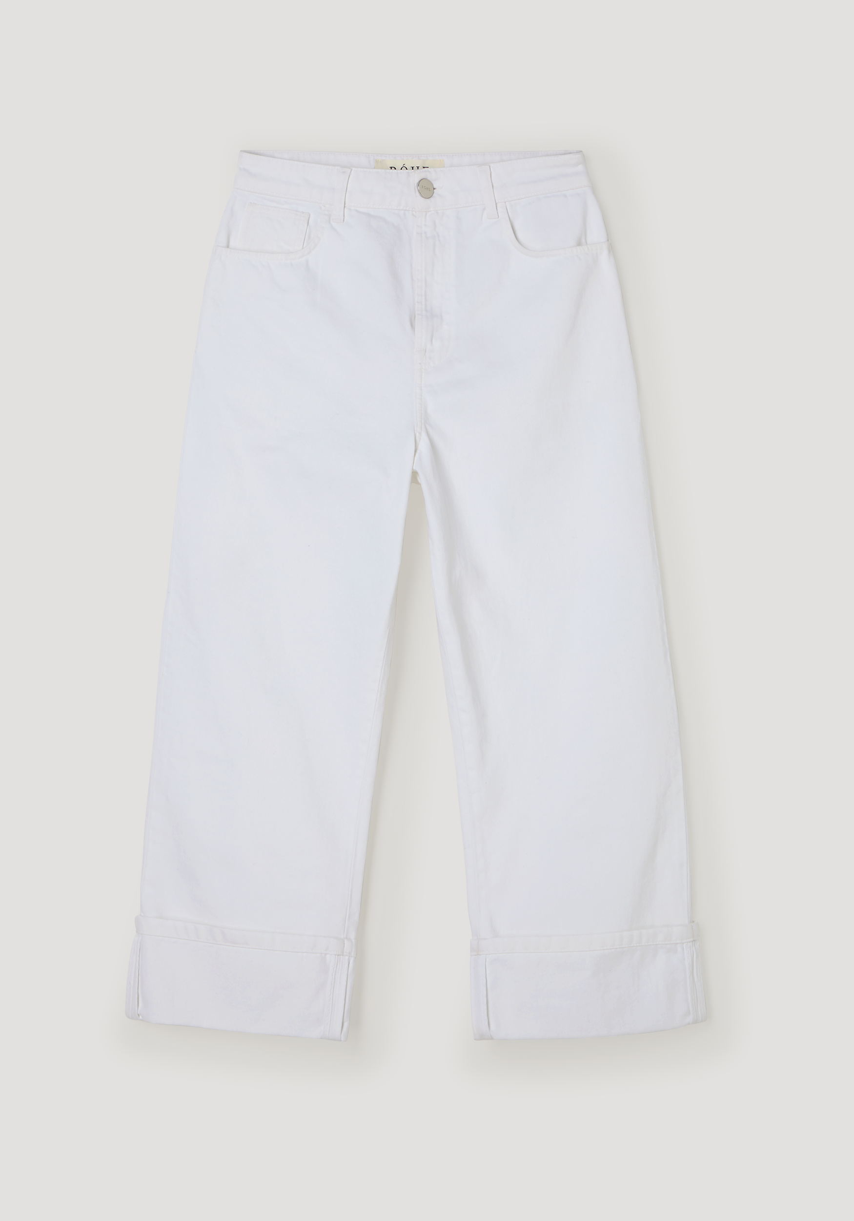 Baggy fit turn-up denim in optic white, featuring a low-waist, wide-leg design with rolled cuffs, silver button closure, and front pockets, made of 100% cotton.