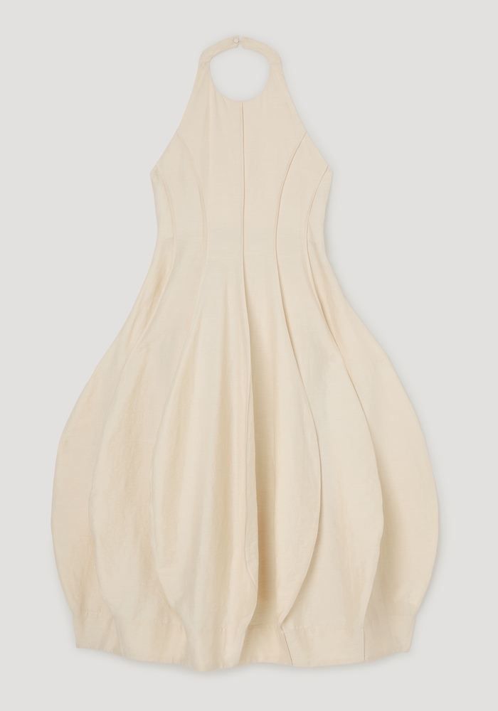Open back tulip dress | butter: Sleeveless halter-neck dress with seam-detailed bodice, pleated balloon skirt, high neckline, and low back. Silk-linen blend with a softly crushed texture.