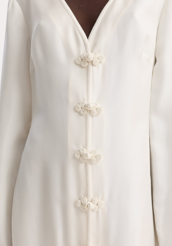 Pankou closure silk dress in cream, showcasing a V-neck and decorative frog closures, crafted from premium silk for a graceful, flowing silhouette.