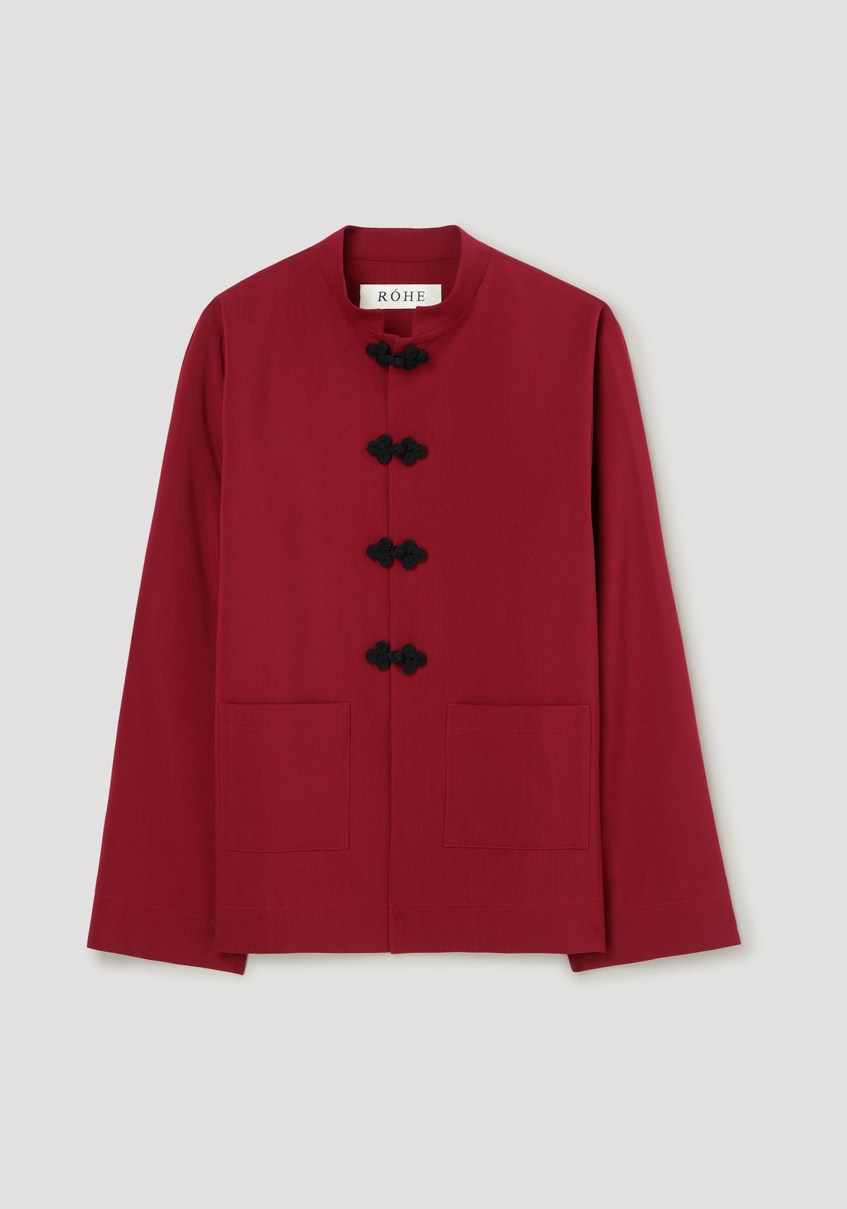 Pankou closure jacket | carmine shown from the front in deep red with black pankou closures a round neckline long sleeves and two patch pockets