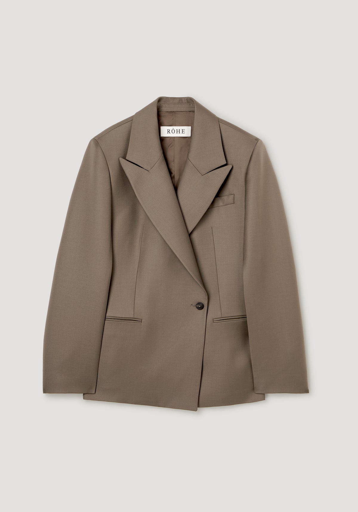 Hourglass shaped blazer | desert brown with peaked lapels single button closure flap pockets and long sleeves shown against a light gray background