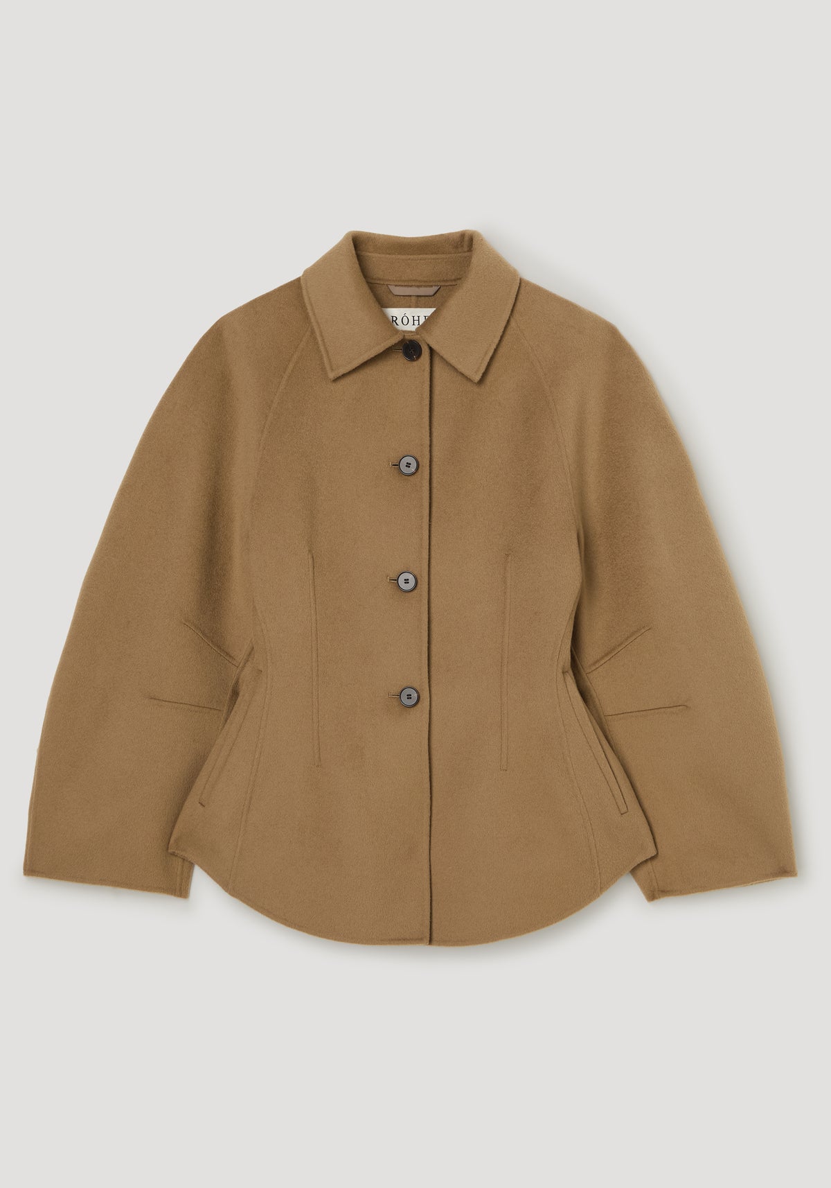 Double-faced sculptural jacket | camel shown front-facing with a pointed collar button fastening curved hem and angled welt pockets