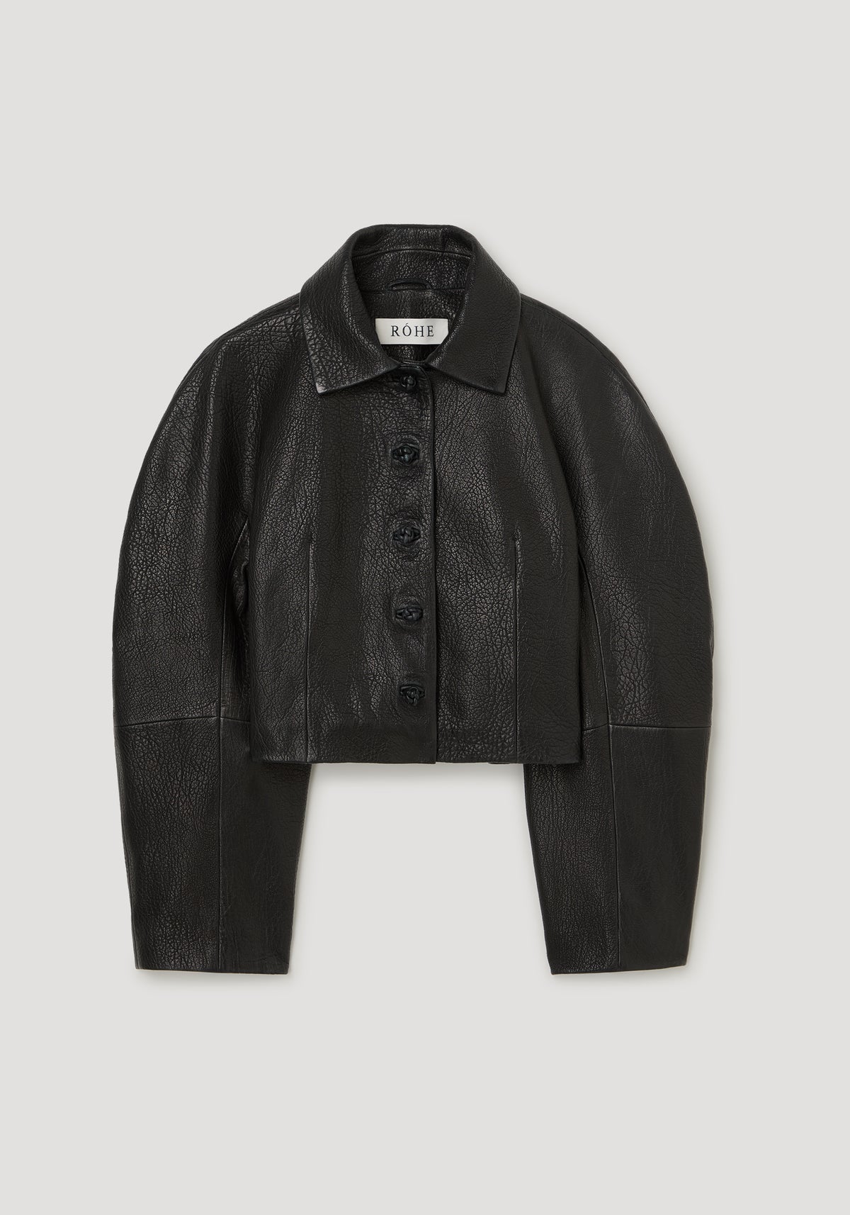 Rounded grain leather cropped jacket | black laid flat with a pointed collar button front long sleeves and textured leather finish