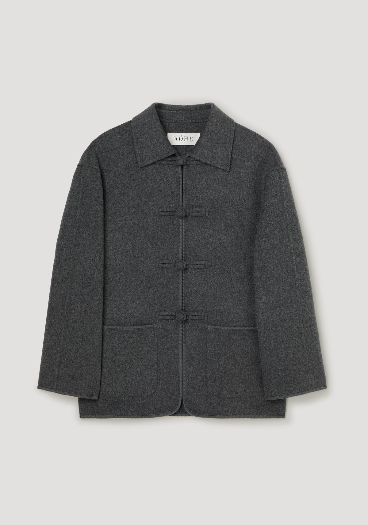 Front view of Double-faced wool pankou closure jacket | dark grey melange with a structured collar long sleeves front pockets and toggle closures on a light background