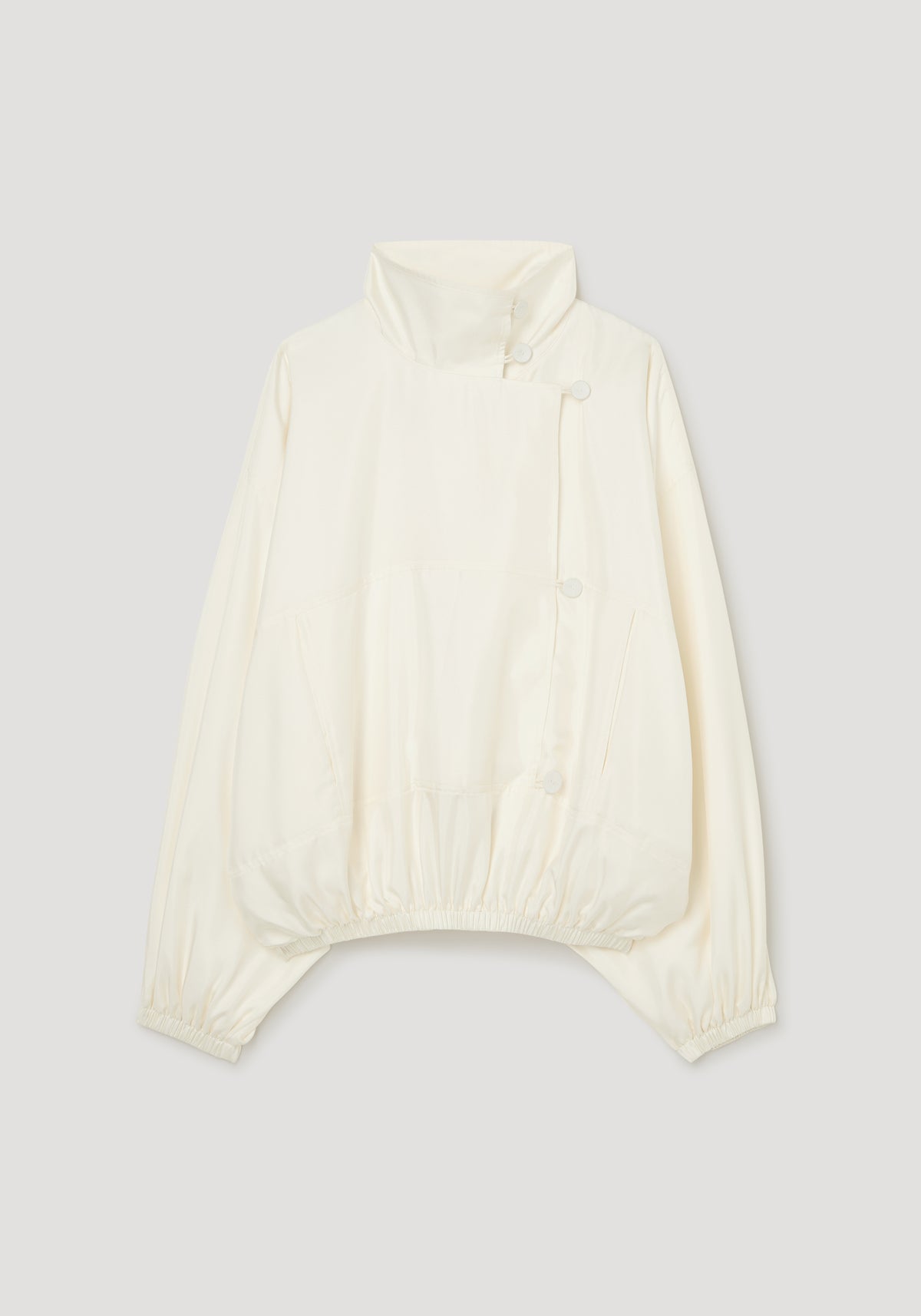 Silk blouson anorak | cream shown flat with a high funnel neck long sleeves front closure and gathered elastic hem and cuffs
