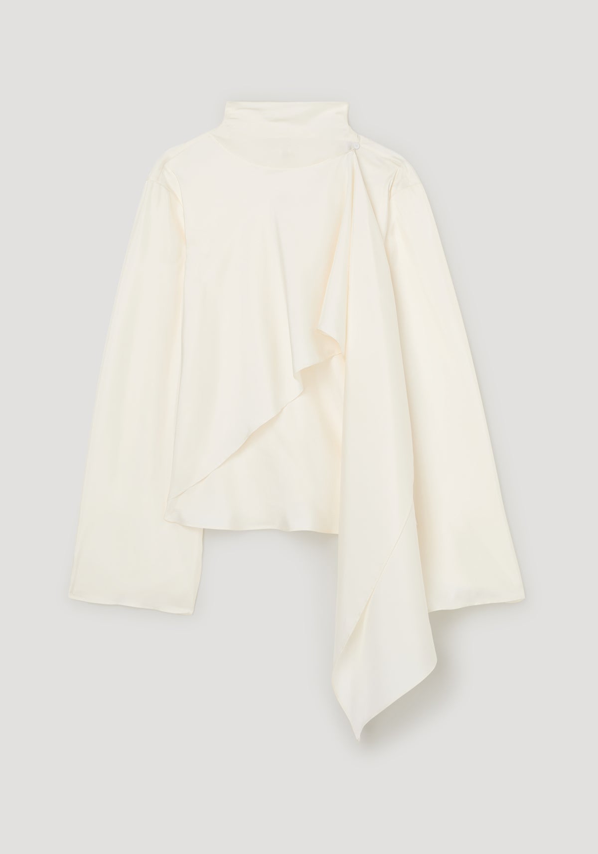 Silk foulard top | cream with a high neckline, long sleeves, and an elegant asymmetrical draped front hem on a neutral background
