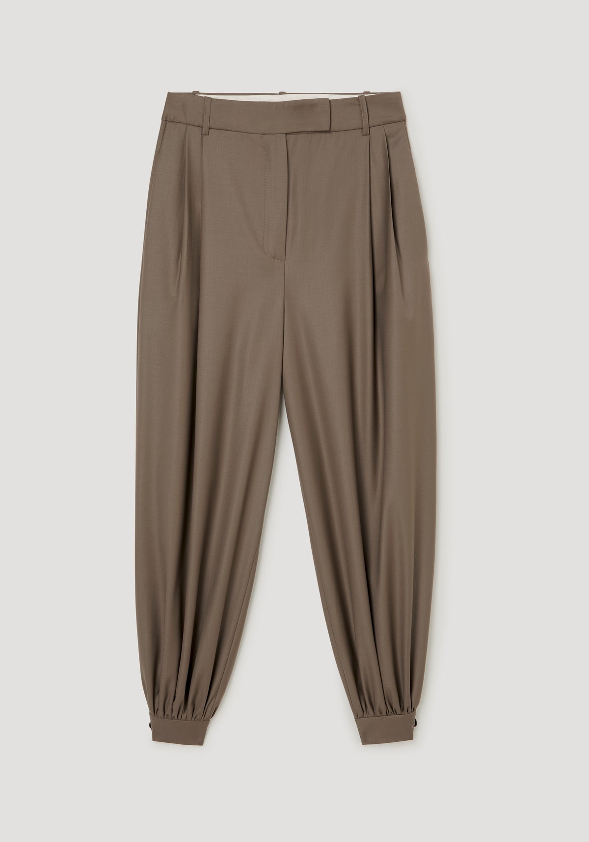 Tailored cuff trousers | desert brown shown flat with a high waist pleated front tapered legs and gathered ankle cuffs against a neutral background